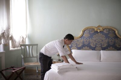 Hard Working Man Fixing The Linen